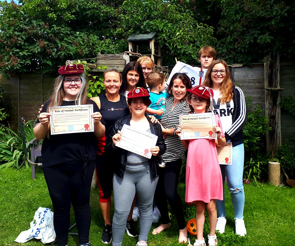 group holding up certificates